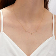 14k Yellow Gold Floating Triple Baguette White Sapphire Necklace